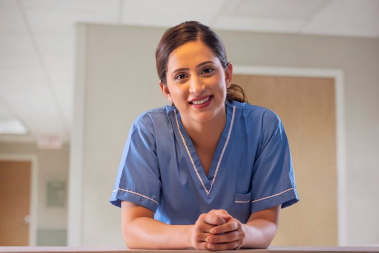 Portrait,Of,A,Smiling,Indian,Female,Nurse,In,Hospital