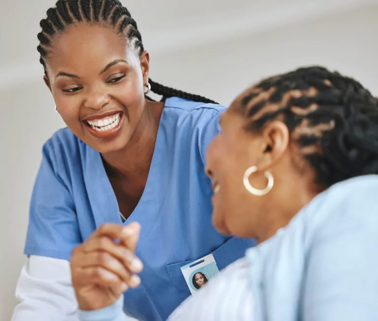 Senior,Patient,,Laughing,And,Woman,Nurse,Together,For,Support,,Healthcare